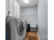 Laundry room featuring a washer and dryer, a sink, and overhead cabinets at 1668 Onyx Rdg # 116, Fort Mill, SC 29708