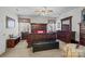 Spacious main bedroom with wood furnishings, a ceiling fan, and natural light at 1668 Onyx Rdg # 116, Fort Mill, SC 29708