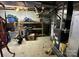 Unfinished storage basement with exposed duct work and block walls at 18 Pickett Ave, Spencer, NC 28159