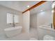 Modern bathroom with soaking tub, walk-in shower, and double vanity at 18 Pickett Ave, Spencer, NC 28159