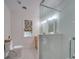 Clean bathroom featuring a glass-enclosed shower, neutral tile, and modern fixtures at 18 Pickett Ave, Spencer, NC 28159