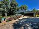 Striking home with modern architecture, attached garage, and an inviting pool surrounded by lush greenery at 18 Pickett Ave, Spencer, NC 28159