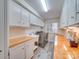 Functional laundry room with plenty of storage cabinets, counter space, and modern appliances at 18 Pickett Ave, Spencer, NC 28159