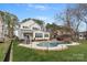 Gorgeous backyard featuring an inground pool, outdoor kitchen and manicured lawn at 20601 Island Forest Dr, Cornelius, NC 28031
