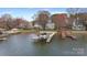 Aerial view of a boat dock on the lake, surrounded by trees at 20601 Island Forest Dr, Cornelius, NC 28031