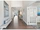 Spacious hallway with hardwood floors leading to lake view and featuring elegant decor and natural light at 20601 Island Forest Dr, Cornelius, NC 28031