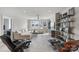 Bright living room with ample natural light, plush seating, and elegant decor, with shelves at 20601 Island Forest Dr, Cornelius, NC 28031