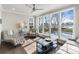 Bright sunroom featuring large windows with views of the pool and backyard at 20601 Island Forest Dr, Cornelius, NC 28031