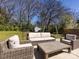 Backyard featuring a patio with outdoor seating, large grassy area, shed and mature trees at 225 Marion St, Rock Hill, SC 29730