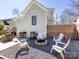 Outdoor living space with a fire pit, grill, seating, and privacy fence for entertaining at 225 Marion St, Rock Hill, SC 29730