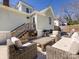 Outdoor living space with patio furniture, grill, stairs to backdoor and privacy fence at 225 Marion St, Rock Hill, SC 29730