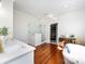 Bright bathroom with a glass shower, soaking tub, vanity, and a doorway to walk-in closet at 225 Marion St, Rock Hill, SC 29730