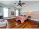 Bright bedroom features stylish color palette, hardwood floors, and great natural light from two windows at 225 Marion St, Rock Hill, SC 29730