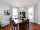 Bright dining room featuring a rustic wood table, statement chandelier, and hardwood floors at 225 Marion St, Rock Hill, SC 29730