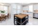 Bright kitchen with stainless appliances, white cabinets, tile floor and a butcher block island at 225 Marion St, Rock Hill, SC 29730
