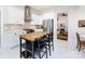 Well-lit kitchen featuring stainless steel appliances, white cabinets, and a butcher block island at 225 Marion St, Rock Hill, SC 29730