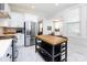 Bright kitchen with stainless appliances, white cabinets, and a butcher block island at 225 Marion St, Rock Hill, SC 29730