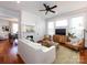 Comfortable living room featuring a fireplace, ceiling fan, and hardwood floors at 225 Marion St, Rock Hill, SC 29730