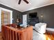 A stylish living room with dark gray walls, a fireplace, guitars, and hardwood floors at 225 Marion St, Rock Hill, SC 29730