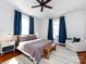 Main bedroom with a ceiling fan, bright windows, hardwood floors and a sitting area at 225 Marion St, Rock Hill, SC 29730