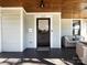 Inviting front porch featuring a dark wood ceiling and lounge area at 225 Marion St, Rock Hill, SC 29730