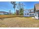 Large backyard with a new fence, grass, and a view of the home at 2325 Winthrop Ave, Charlotte, NC 28203