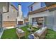 Outdoor living space featuring a fireplace, grill, and comfortable seating, perfect for entertaining guests at 2325 Winthrop Ave, Charlotte, NC 28203