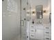 This bathroom features a glass shower, tiled walls, and a modern vanity with a stylish mirror at 2325 Winthrop Ave, Charlotte, NC 28203