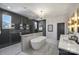 Luxurious bathroom with a soaking tub, glass-enclosed shower, and dual vanities, creating a spa-like atmosphere at 2325 Winthrop Ave, Charlotte, NC 28203