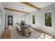 Bright dining room with beamed ceiling, modern lighting, and large windows offering pleasant views at 2325 Winthrop Ave, Charlotte, NC 28203