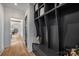 Hallway showcasing a mudroom organizer with individual storage and a bench seat at 2325 Winthrop Ave, Charlotte, NC 28203