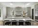 Modern kitchen featuring a spacious island with seating, custom cabinets, and designer backsplash at 2325 Winthrop Ave, Charlotte, NC 28203
