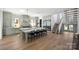 Bright, open kitchen boasts a large island, stainless appliances, and convenient access to the staircase at 2325 Winthrop Ave, Charlotte, NC 28203