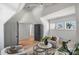 Inviting living area with comfortable seating, complemented by a modern ceiling fan and views from several windows at 2325 Winthrop Ave, Charlotte, NC 28203