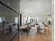 Bright and airy living room featuring modern furnishings, hardwood floors, and large windows offering natural light at 2325 Winthrop Ave, Charlotte, NC 28203