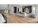 Hardwood floors and an open staircase highlight this spacious living room with stylish decor and modern lighting at 2325 Winthrop Ave, Charlotte, NC 28203