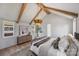 Serene primary bedroom with vaulted ceiling, exposed beams, and natural light, offering a peaceful sanctuary at 2325 Winthrop Ave, Charlotte, NC 28203