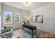 Bright office with a modern desk, natural light from large windows, and seating area at 2325 Winthrop Ave, Charlotte, NC 28203