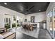 Outdoor dining area featuring a large fan, kitchenette, and views of the yard at 2325 Winthrop Ave, Charlotte, NC 28203