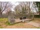 Backyard wooden deck with grill and seating area with wooden lattice surround at 2577 Kingston St, Newton, NC 28658