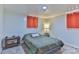 Cozy bedroom featuring neutral walls, tile flooring, and two windows for ample natural light at 2577 Kingston St, Newton, NC 28658