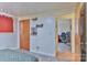 Bedroom featuring a wood-paneled closet and connecting door to the office at 2577 Kingston St, Newton, NC 28658