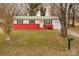 Charming single-story home with red brick foundation, yellow door, and well-maintained lawn at 2577 Kingston St, Newton, NC 28658
