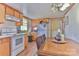 Charming kitchen features wood cabinets and appliances; dining area included at 2577 Kingston St, Newton, NC 28658