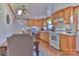 Cozy kitchen features wood cabinets, white appliances, and a dining space at 2577 Kingston St, Newton, NC 28658