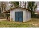 Exterior shot of storage shed in backyard with weathered metallic exterior at 2577 Kingston St, Newton, NC 28658