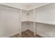 Large walk-in closet with shelving and hardwood floors at 2829 New Pineola Rd # 7B, Charlotte, NC 28208