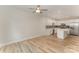 Bright living space with hardwood floors, ceiling fan, and modern kitchen at 2829 New Pineola Rd # 7B, Charlotte, NC 28208