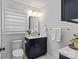 Contemporary bathroom with black vanity, marble countertop, and brushed gold hardware at 2913 Archdale Dr, Charlotte, NC 28210