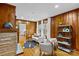 Bright living room with wood paneling, fireplace, and comfortable seating at 2913 Archdale Dr, Charlotte, NC 28210